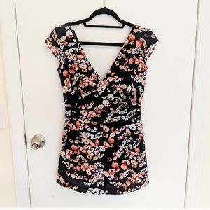 Bebe black & floral romper w/ pockets & back tie